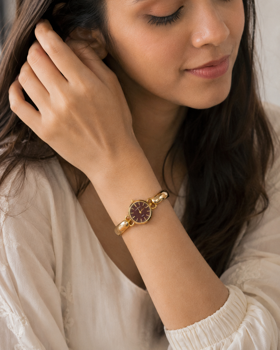 Sculptural Gold Watch with Burgundy Textured Dial