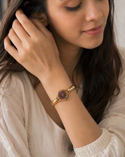 Sculptural Gold Watch with Burgundy Textured Dial