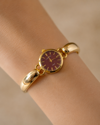 Sculptural Gold Watch with Burgundy Textured Dial
